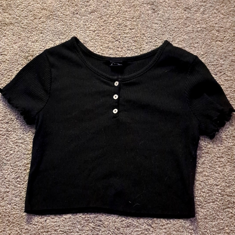 A black button crop top